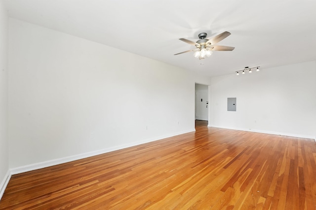 2520 Kennedy Blvd Unit 4J, Jersey City, NJ 07304 - spare room featuring electric panel, rail lighting, ceiling fan, and light wood-style flooring