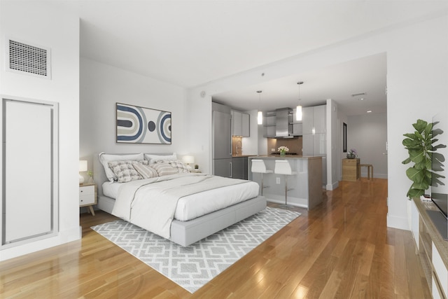77 Hudson St Unit 1712, Jersey City, NJ 07302 - bedroom with light wood-style flooring and baseboards