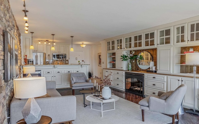 380 Mountain Rd Unit 808, Union City, NJ 07087 - living room with wine cooler, dark wood-style flooring, and a fireplace