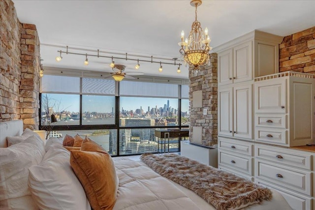 380 Mountain Rd Unit 808, Union City, NJ 07087 - bedroom with a view of skyline, a chandelier, and multiple windows