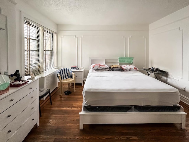 36 Duncan Ave Unit D2, Jersey City, NJ 07304 - bedroom with dark wood finished floors and a textured ceiling