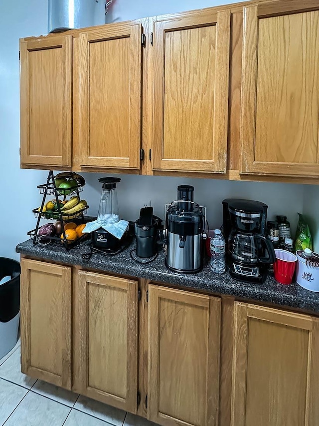 36 Duncan Ave Unit D2, Jersey City, NJ 07304 - kitchen featuring light tile patterned flooring and dark stone counters
