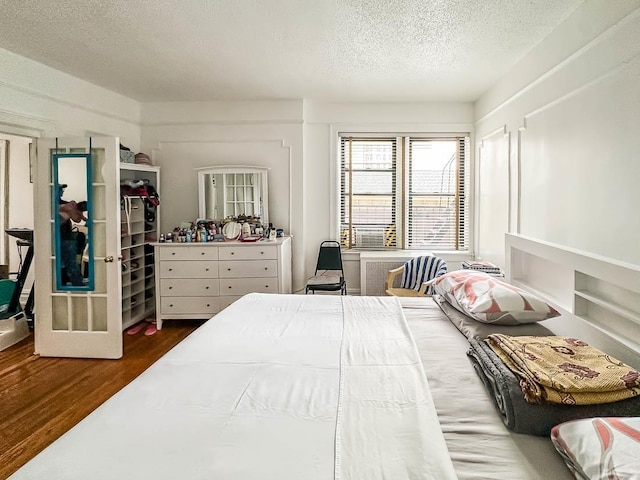 36 Duncan Ave Unit D2, Jersey City, NJ 07304 - bedroom featuring a textured ceiling and wood finished floors
