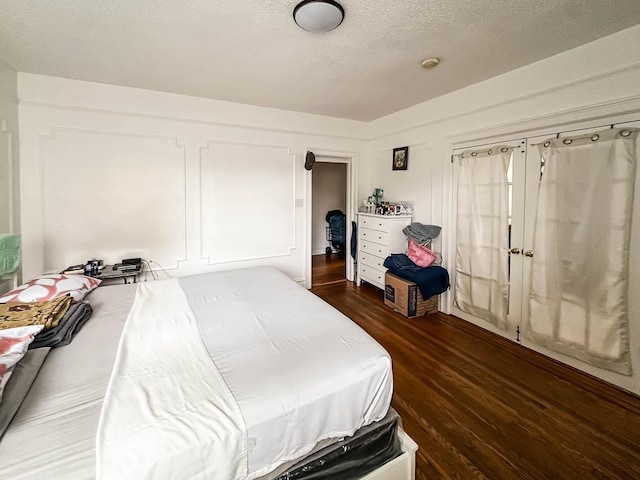 36 Duncan Ave Unit D2, Jersey City, NJ 07304 - bedroom with dark wood-style floors and a textured ceiling