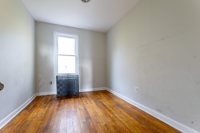 spare room featuring hardwood / wood-style floors