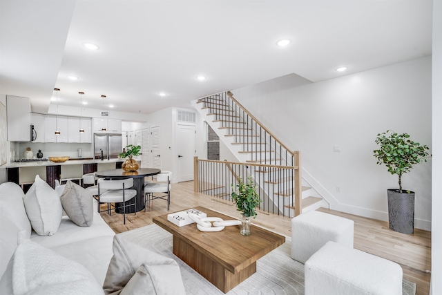 living room with light hardwood / wood-style flooring