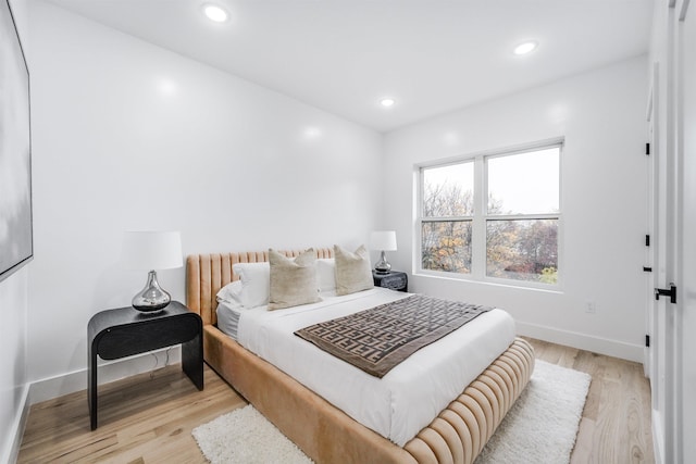 bedroom with light wood-type flooring