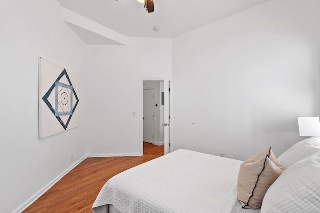 bedroom with wood-type flooring and ceiling fan