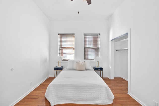 bedroom featuring hardwood / wood-style flooring and ceiling fan