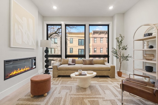 sitting room with light hardwood / wood-style flooring