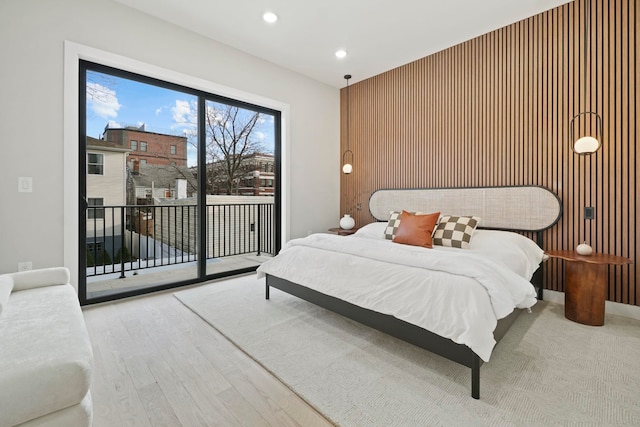 bedroom with light hardwood / wood-style flooring and access to outside