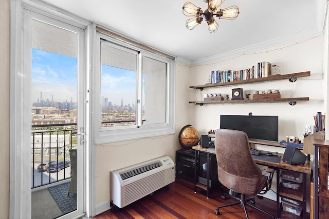 office featuring a wall unit AC, wood finished floors, and healthy amount of natural light