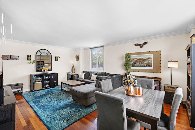 living room featuring wood-type flooring and ornamental molding