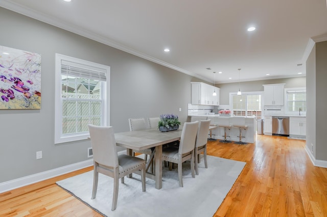 347 Forest St, Kearny, NJ 07032 - dining space featuring light wood-type flooring, ornamental molding, recessed lighting, and baseboards