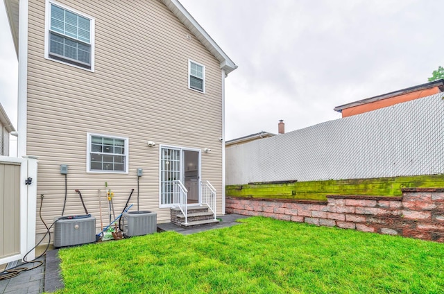 347 Forest St, Kearny, NJ 07032 - back of property featuring entry steps, central air condition unit, and a yard