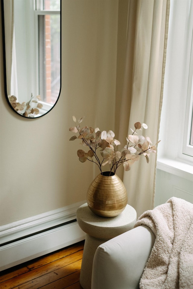 112 Wayne St Unit 2-A, Jersey City, NJ 07302 - detailed view of a baseboard heating unit and wood finished floors
