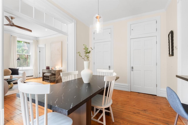 112 Wayne St Unit 2-A, Jersey City, NJ 07302 - dining space with crown molding, light wood-style flooring, and baseboard heating