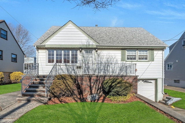 view of front facade with a garage and a front lawn