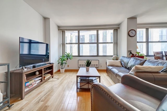 living room with plenty of natural light and light wood-type flooring