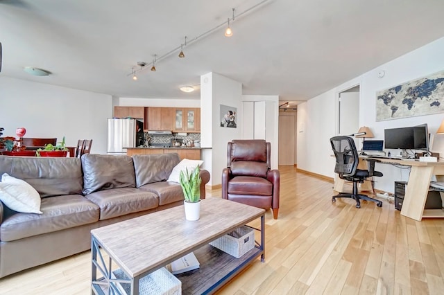 living room with light hardwood / wood-style flooring