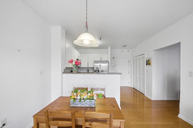 30 Freedom Way Unit 306, Jersey City, NJ 07305 - dining room with wood finished floors and baseboards