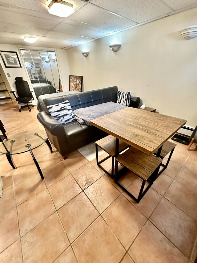 306 Columbia Ave, Jersey City, NJ 07307 - living room with a drop ceiling and light tile patterned flooring