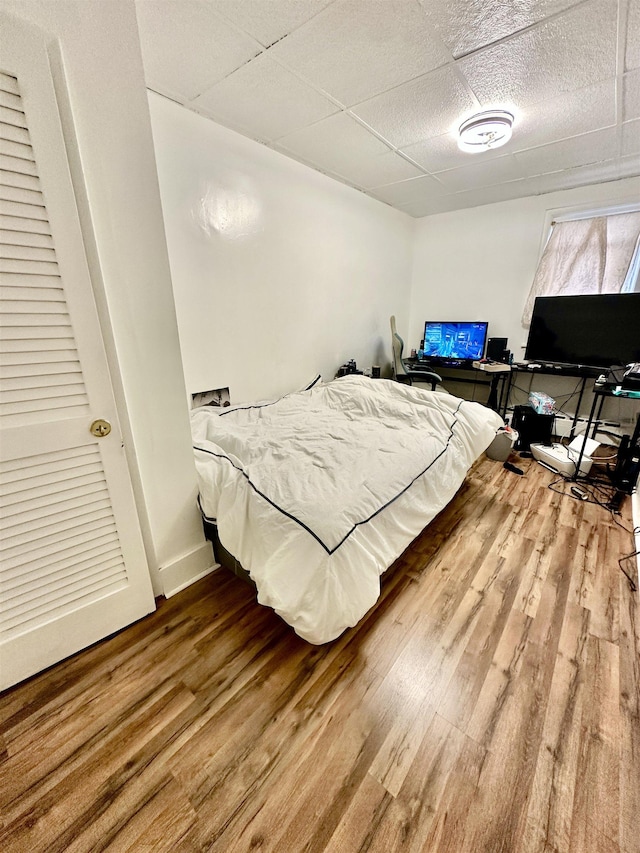 306 Columbia Ave, Jersey City, NJ 07307 - bedroom with a drop ceiling and wood finished floors