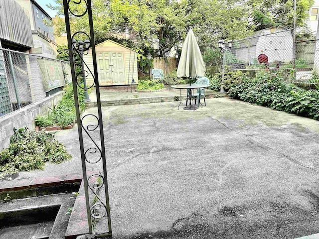 306 Columbia Ave, Jersey City, NJ 07307 - fenced backyard with a patio area and a shed