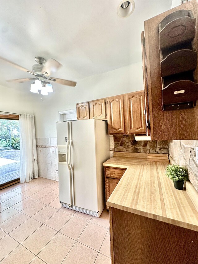 306 Columbia Ave, Jersey City, NJ 07307 - kitchen with white refrigerator with ice dispenser, light tile patterned flooring, and a ceiling fan
