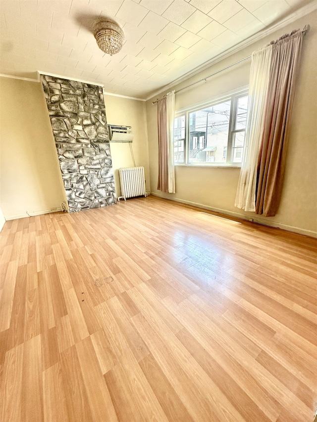 306 Columbia Ave, Jersey City, NJ 07307 - unfurnished room featuring radiator, ornamental molding, wood finished floors, and a wall mounted AC