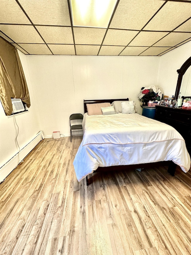 306 Columbia Ave, Jersey City, NJ 07307 - bedroom featuring a drop ceiling, wood finished floors, and cooling unit