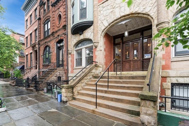 property entrance with brick siding