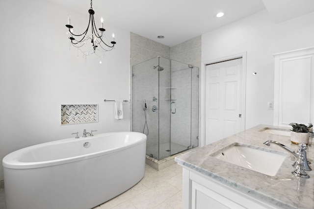 full bath with a sink, a soaking tub, a shower stall, and double vanity