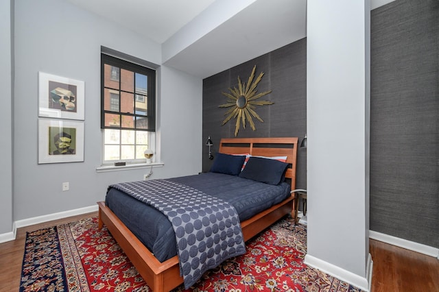 187 Wayne St Unit 205, Jersey City, NJ 07302 - bedroom featuring baseboards and wood finished floors