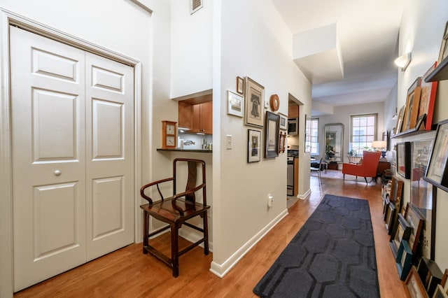 187 Wayne St Unit 205, Jersey City, NJ 07302 - hall with light wood finished floors and baseboards