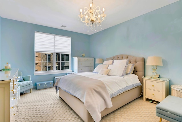 bedroom featuring carpet floors, visible vents, and a chandelier