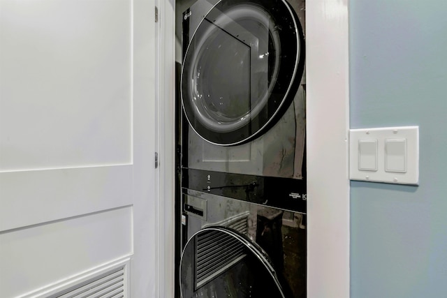 laundry room featuring laundry area and stacked washer and dryer