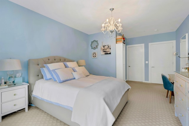 bedroom featuring a chandelier and light carpet
