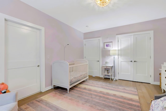 bedroom with baseboards and light wood-style floors