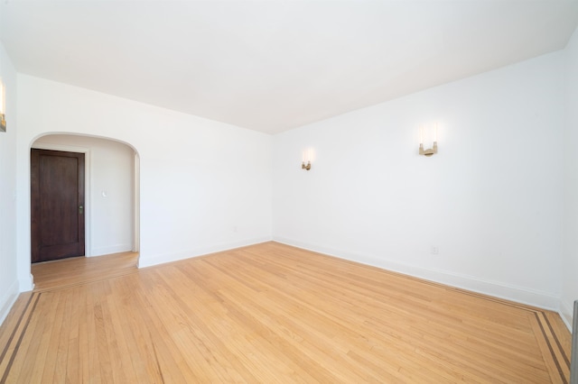 1100 83rd St Unit C1, North Bergen, NJ 07047 - unfurnished room with arched walkways and light wood-type flooring