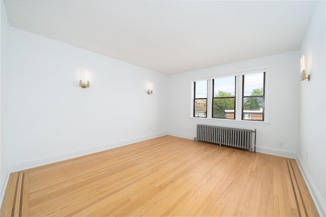 1100 83rd St Unit C1, North Bergen, NJ 07047 - empty room featuring radiator heating unit and light wood finished floors
