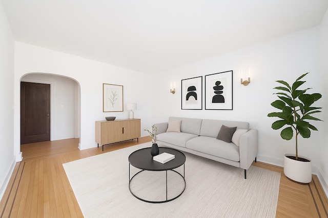 1100 83rd St Unit C1, North Bergen, NJ 07047 - living area with arched walkways and light wood-type flooring