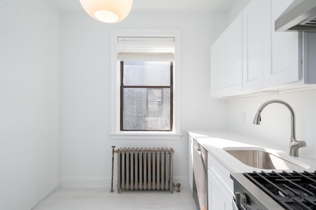 1100 83rd St Unit C1, North Bergen, NJ 07047 - kitchen featuring radiator heating unit, range hood, white cabinetry, light countertops, and stainless steel dishwasher