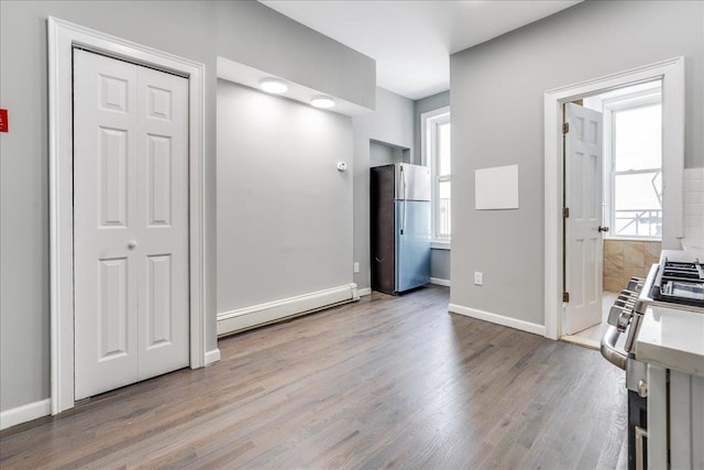 402 Grand St Unit 3S, Hoboken, NJ 07030 - interior space with baseboard heating, wood finished floors, and healthy amount of natural light
