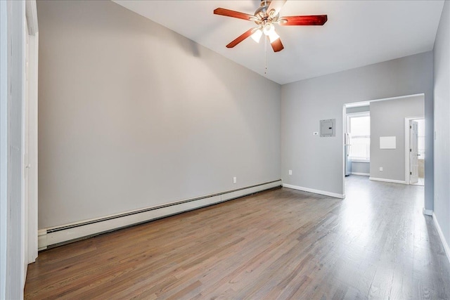 402 Grand St Unit 3S, Hoboken, NJ 07030 - spare room with a baseboard radiator, wood finished floors, a ceiling fan, and electric panel