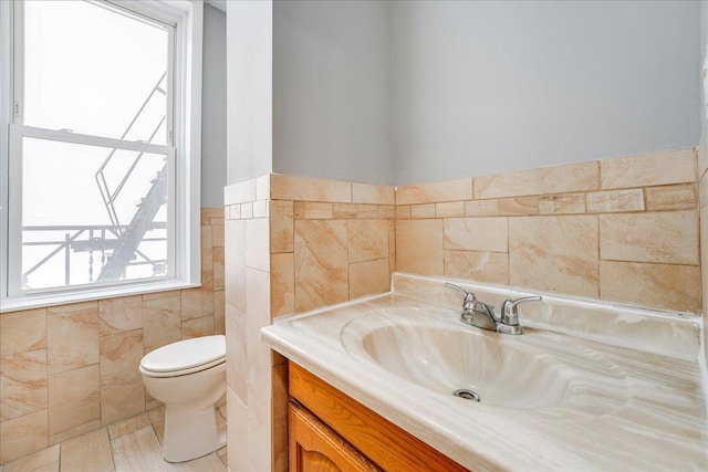 402 Grand St Unit 3S, Hoboken, NJ 07030 - half bath with tile walls, vanity, and wainscoting