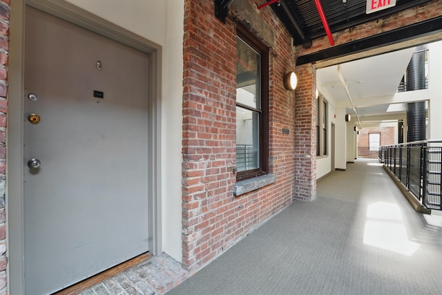 entrance to property with brick siding