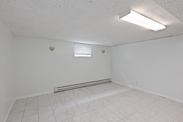 64 W 57th St, Bayonne, NJ 07002 - below grade area with a baseboard radiator and baseboards