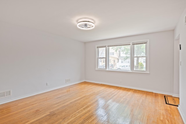 64 W 57th St, Bayonne, NJ 07002 - unfurnished room featuring light wood-style floors and baseboards