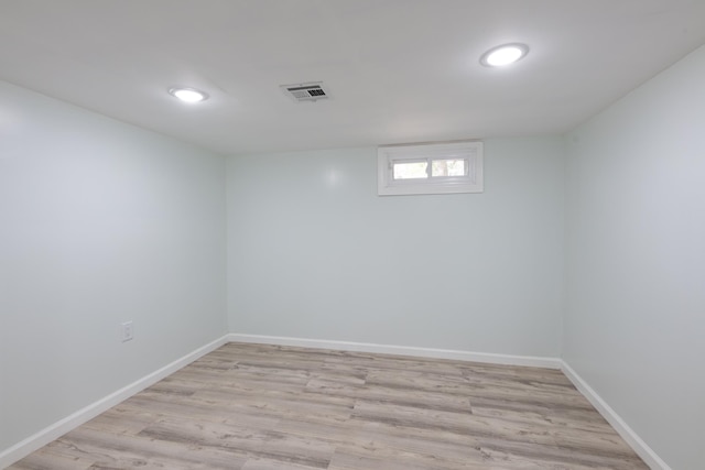 64 W 57th St, Bayonne, NJ 07002 - basement featuring light wood-type flooring, baseboards, and recessed lighting
